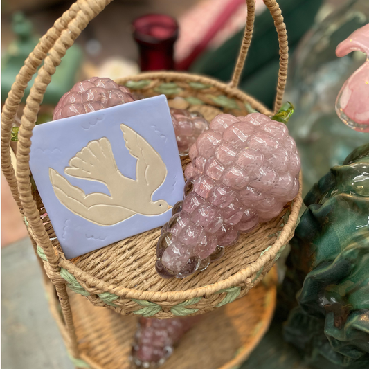 Finished Dove clay tile displayed as a handmade decor piece, inspired by Matthew 3:16 and the presence of the Holy Spirit.