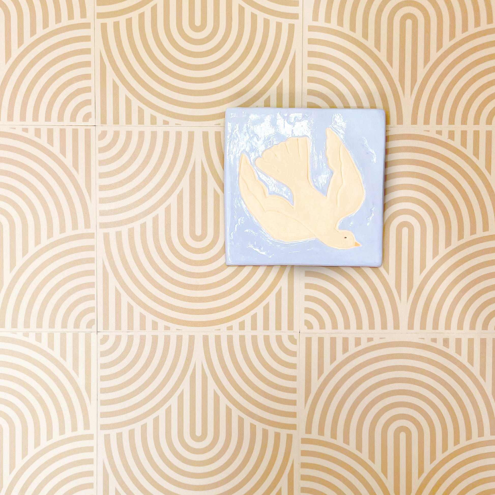 Handmade Dove clay tile with a soft blue background and cream dove design, inspired by Matthew 3:16.