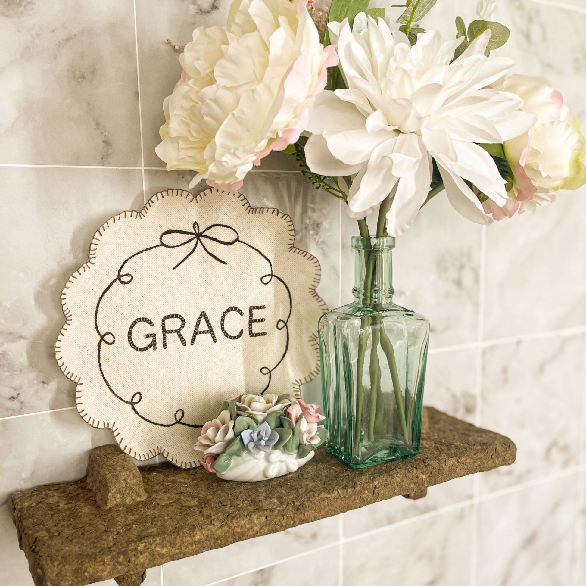 Handmade Fabric Plate Grace displayed with flowers as a Bible-inspired Christian fabric craft project.